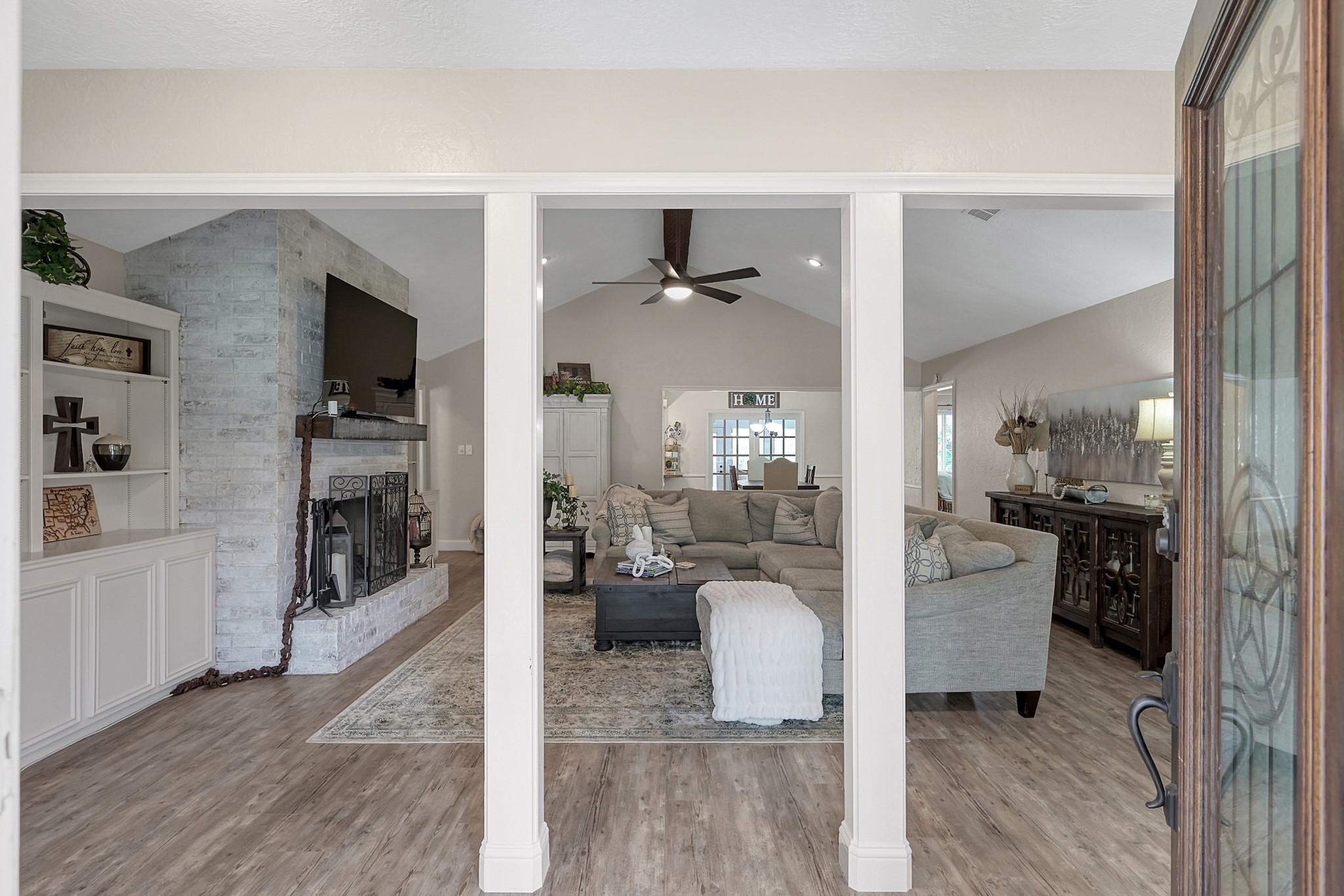 8 Cambridge Road Conroe, TX 77304 - Photo 5 of 44 a view of living room kitchen with furniture and wooden floor