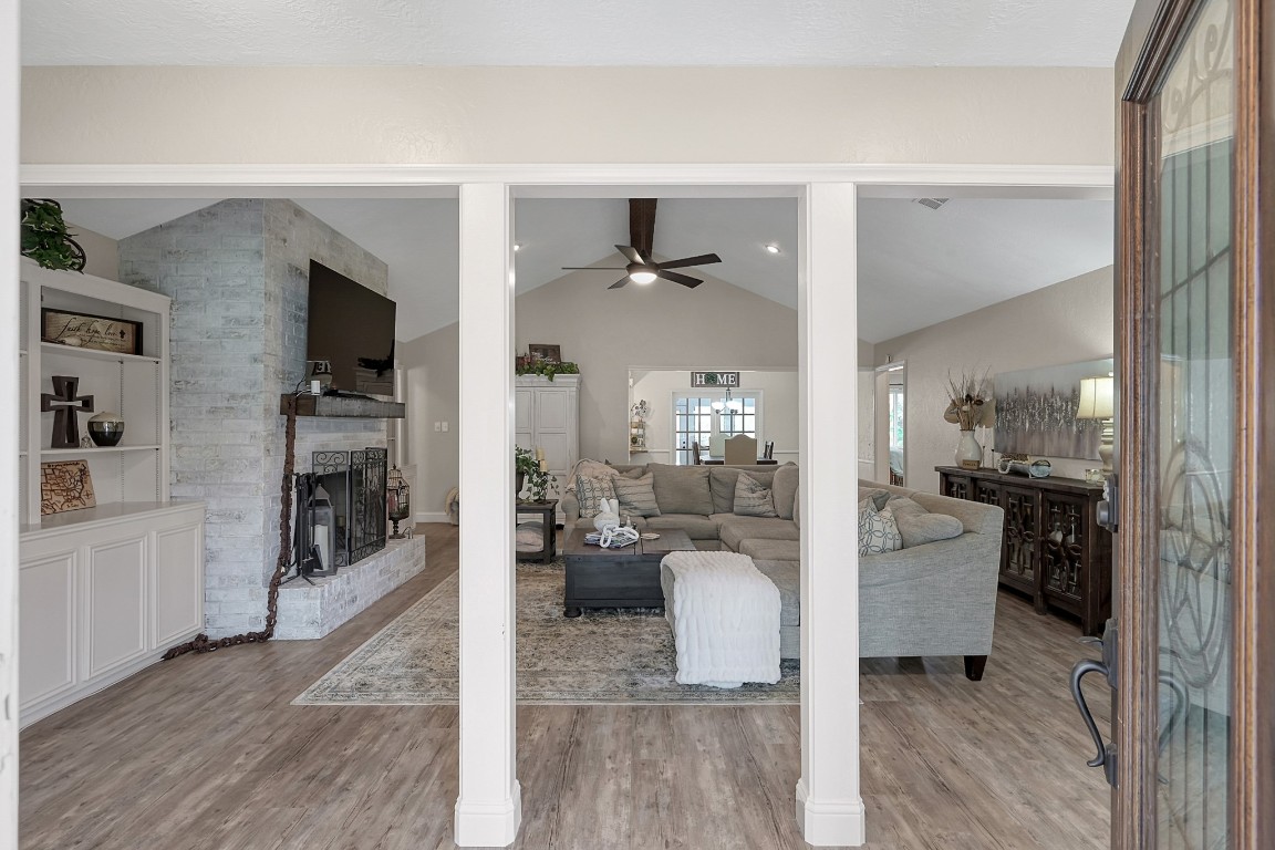 8 Cambridge Road Conroe, TX 77304 - Photo 5 of 44 a view of living room kitchen with furniture and wooden floor