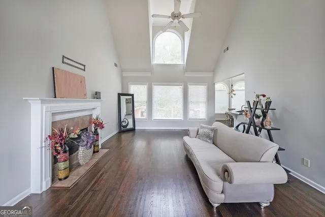 a living room with furniture and a fireplace
