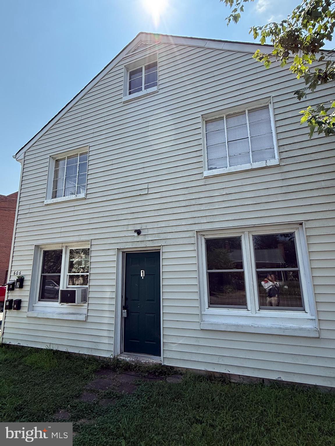 606 Stuart Street, Unit 1 Fredericksburg, VA 22401 - Photo 3 of 13 a view of a house with a yard