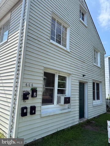 a view of house with yard