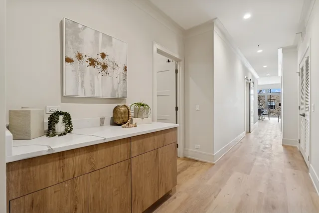 a view of a tall building next to a yard