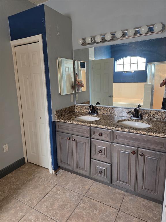 2850 Sheldon Street Lakeland, FL 33813 - Photo 13 of 23 a bathroom with a granite countertop sink and a mirror