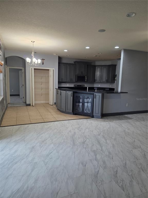 2850 Sheldon Street Lakeland, FL 33813 - Photo 10 of 23 a view of kitchen with refrigerator and microwave