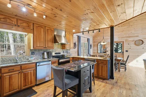 a kitchen with lots of counter top space and a window