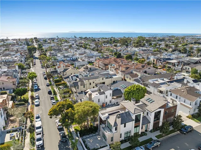 an aerial view of residential building with parking