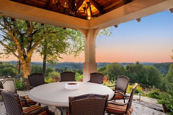 a view of a dining room with furniture wooden floor and chandelier