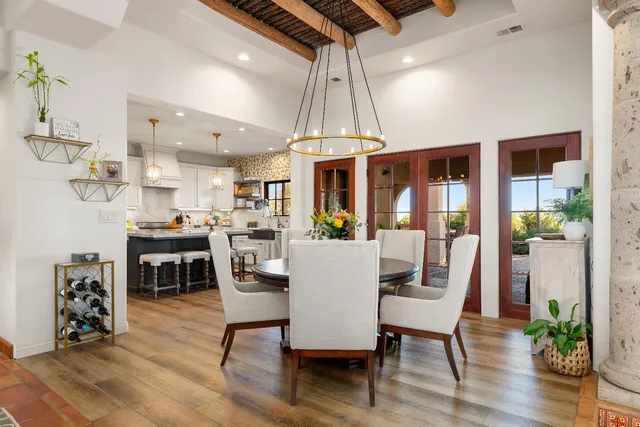 a bedroom with furniture and a flat screen tv