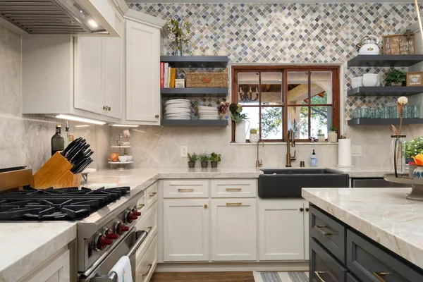 a spacious bedroom with a bed and a flat screen tv