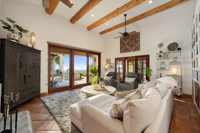 front view of a house with a yard and an trees