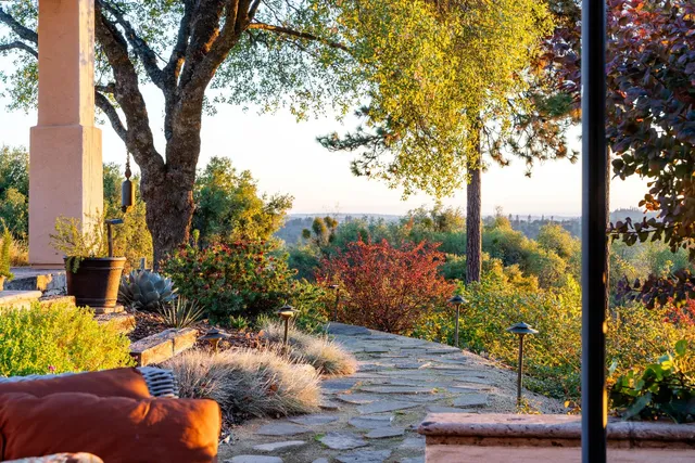 a view of a patio with a table chairs and a table