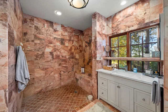 a view of a car park front of a house