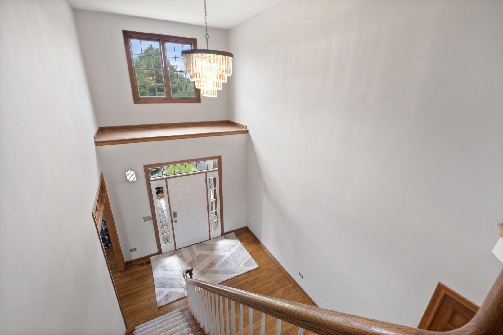 7N265 Ridge Line Road St. Charles, IL 60175 - Photo 19 of 46 a view of a hallway with wooden floor and stairs