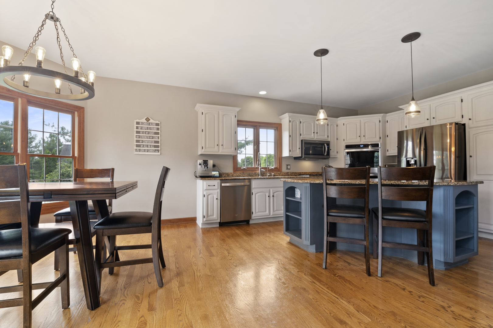 7N265 Ridge Line Road St. Charles, IL 60175 - Photo 9 of 46 a open kitchen with stainless steel appliances granite countertop a stove a refrigerator a kitchen island a dining table and chairs