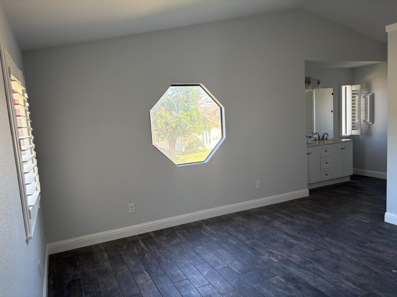 8111 Aztec Way Antelope, CA 95843 - Photo 11 of 17 an empty room with wooden floor and a window