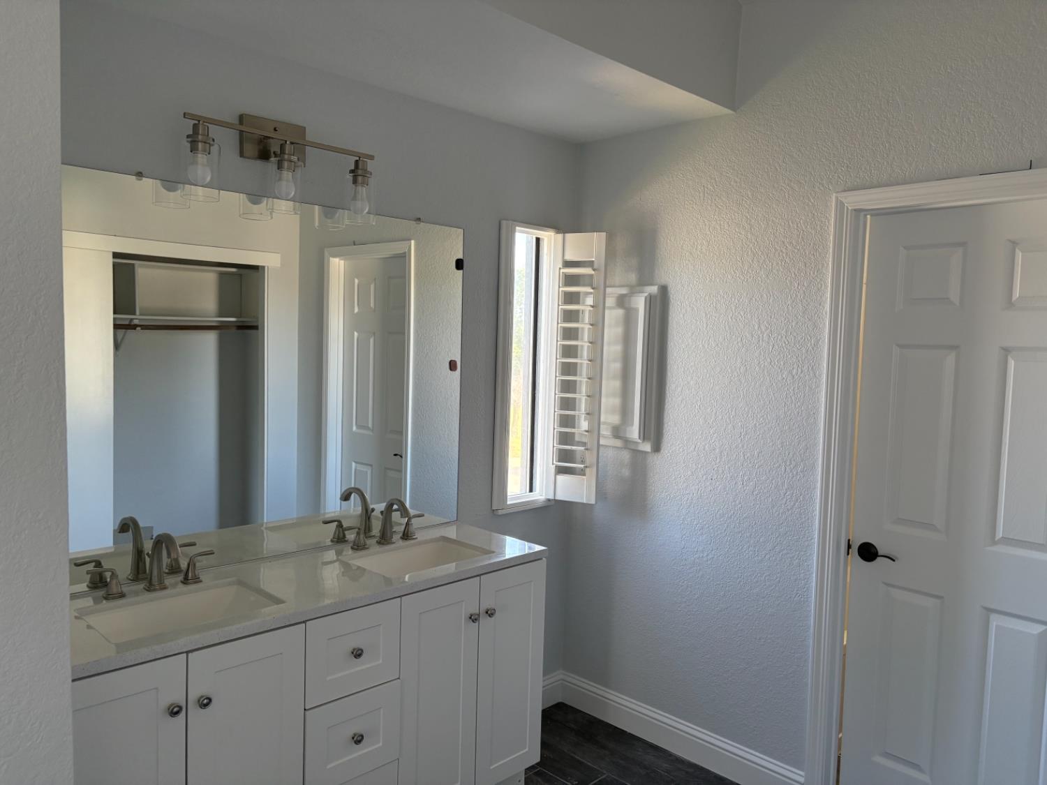 8111 Aztec Way Antelope, CA 95843 - Photo 12 of 17 a bathroom with a granite countertop sink and a mirror