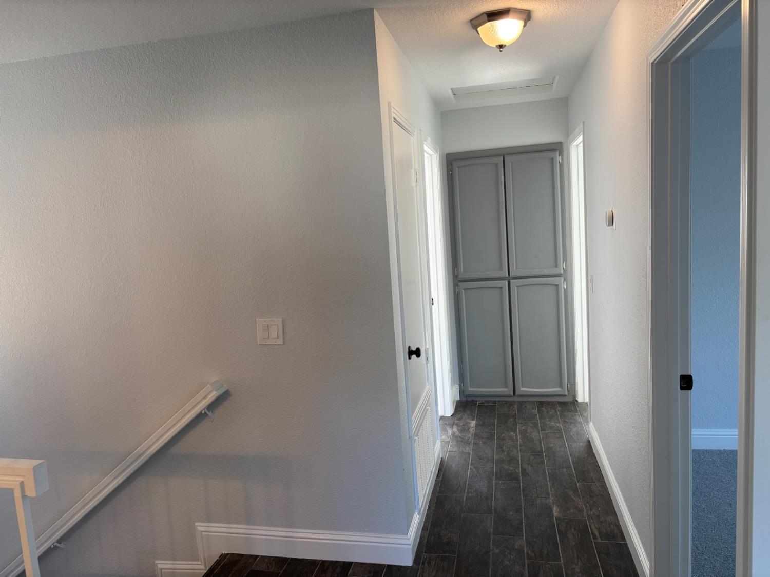 8111 Aztec Way Antelope, CA 95843 - Photo 13 of 17 a view of a hallway with wooden floor