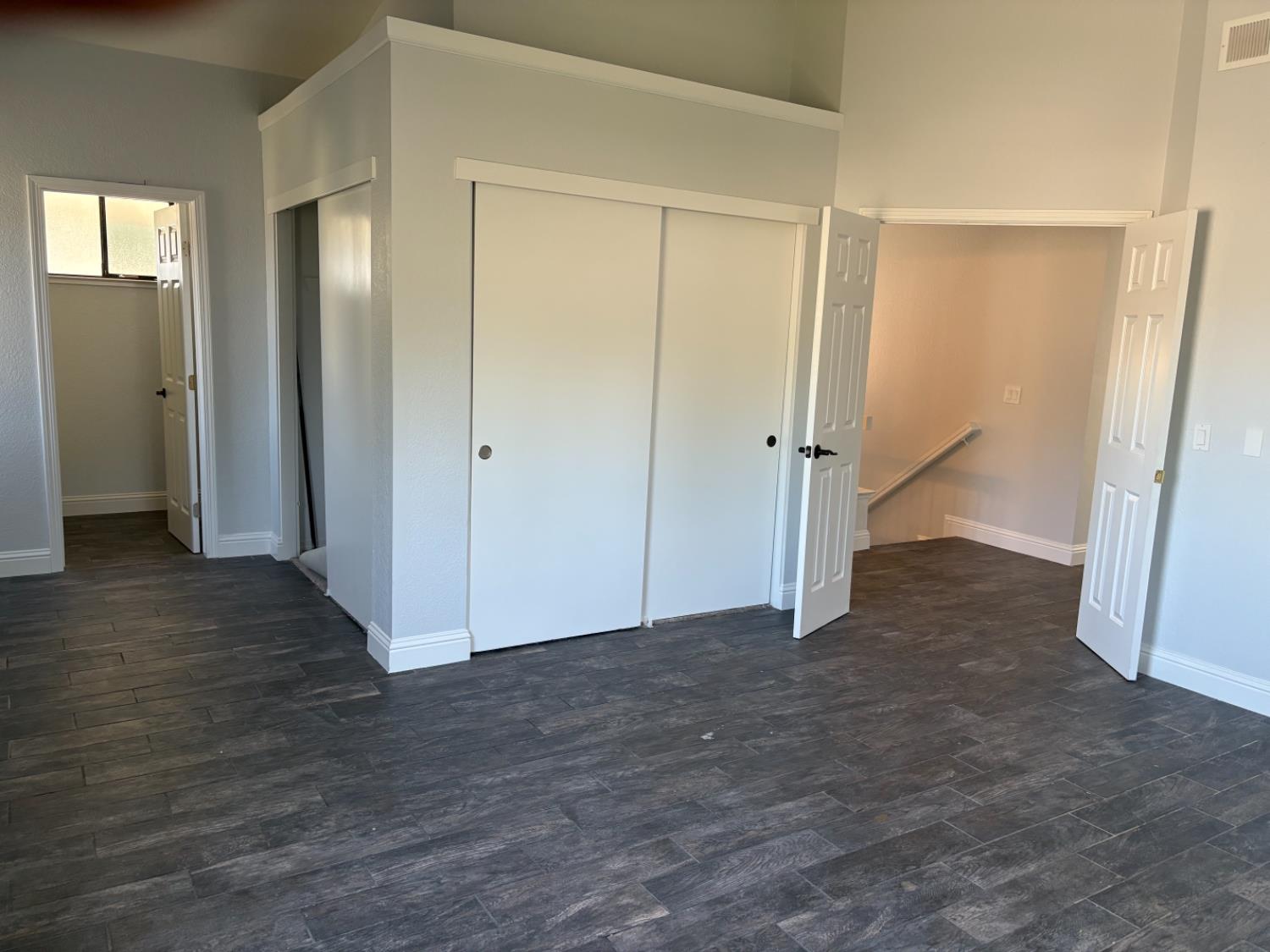 8111 Aztec Way Antelope, CA 95843 - Photo 16 of 17 an empty room with wooden floor and closet area
