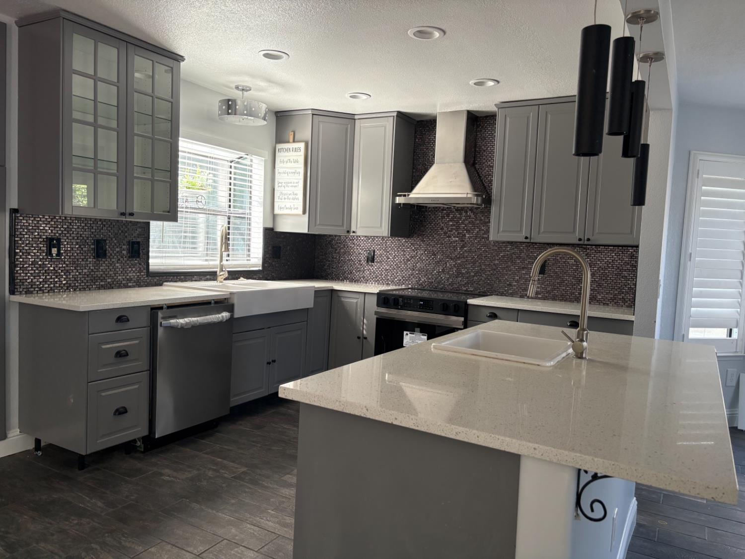 8111 Aztec Way Antelope, CA 95843 - Photo 7 of 17 a kitchen with a sink a stove and cabinets
