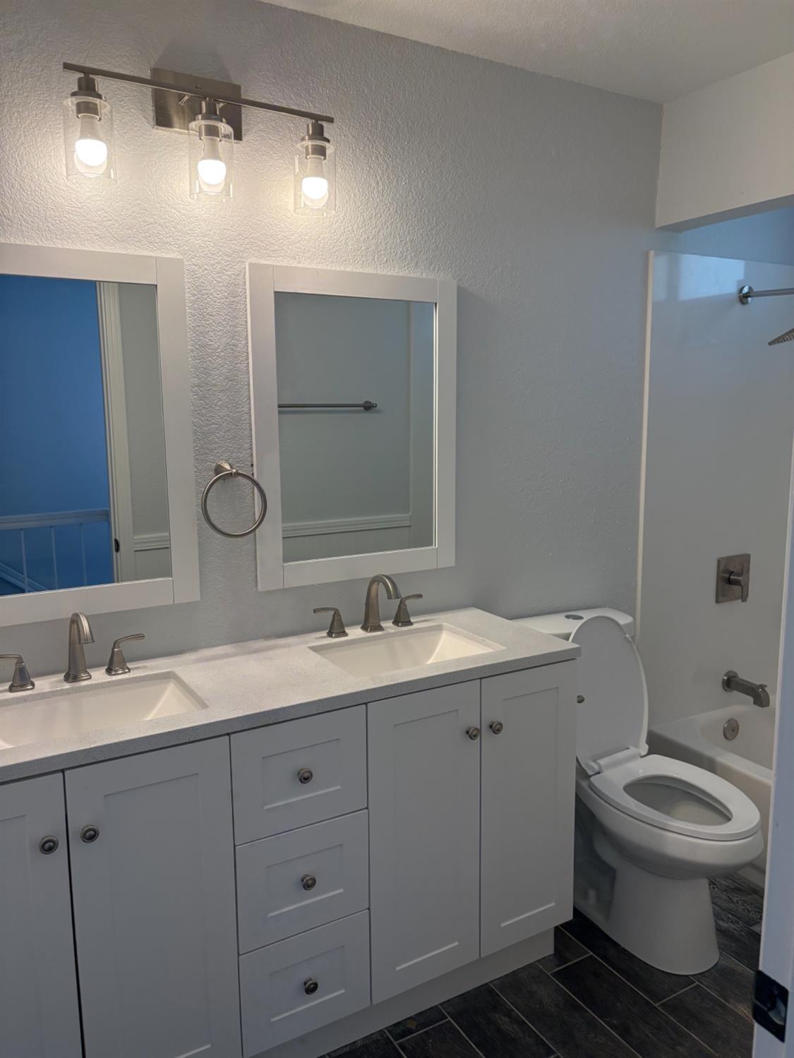 8111 Aztec Way Antelope, CA 95843 - Photo 10 of 17 a bathroom with a toilet sink and mirror