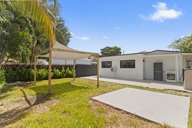 a house view with a backyard space