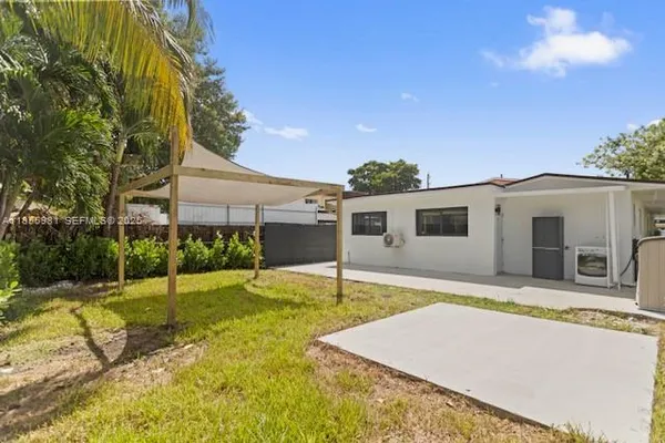 a house view with a backyard space