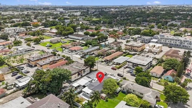 an aerial view of residential houses with outdoor space