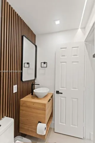 a bedroom with a bed and a cabinet