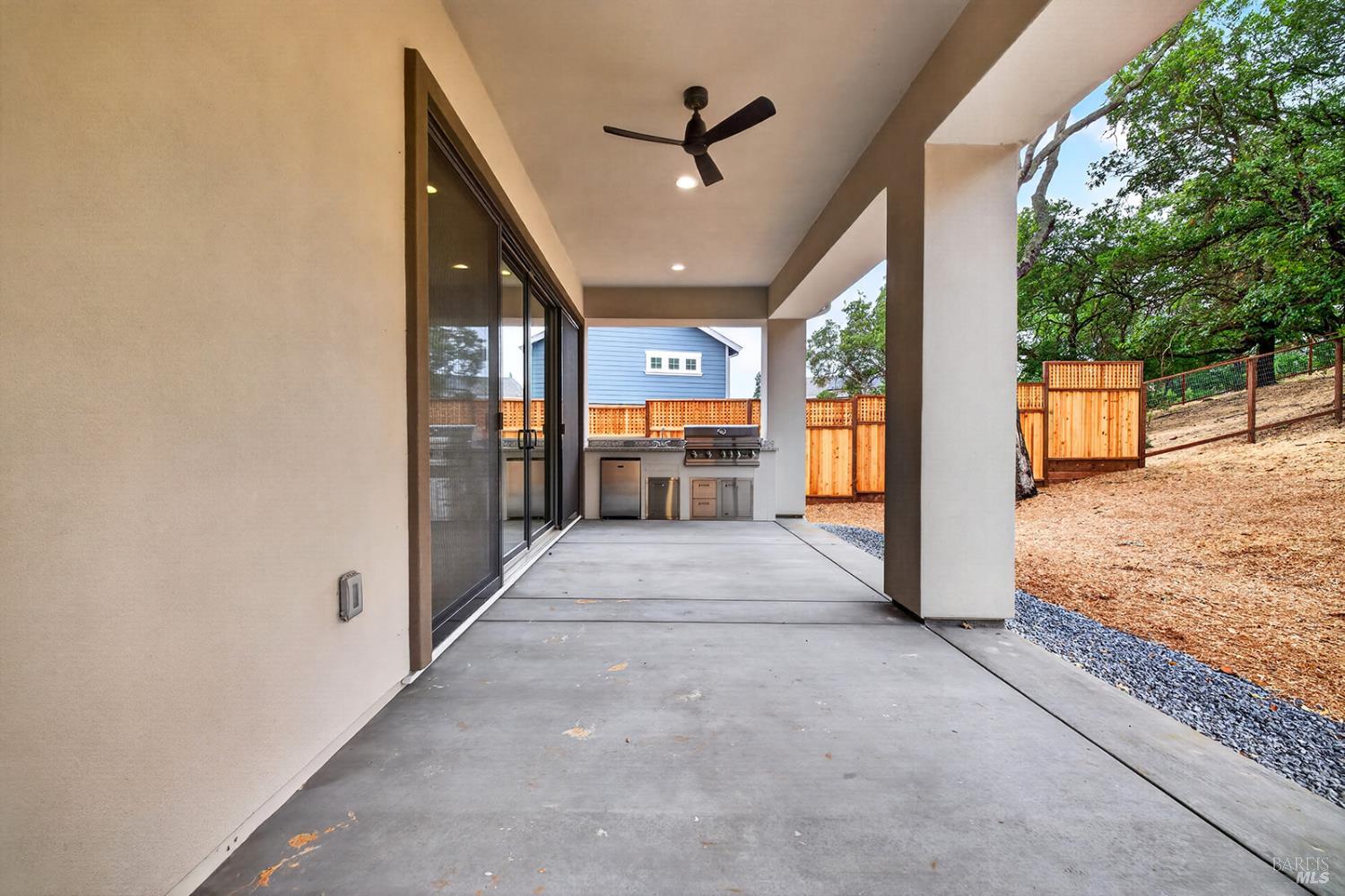 1913 Carlile Place Santa Rosa, CA 95403 - Photo 13 of 60 This home also offers an outdoor kitchen, complete with a stainless BBQ (operated by a propane tank), refrigerator, sink and storage drawers. Glass doors to the left lead back into the great room.