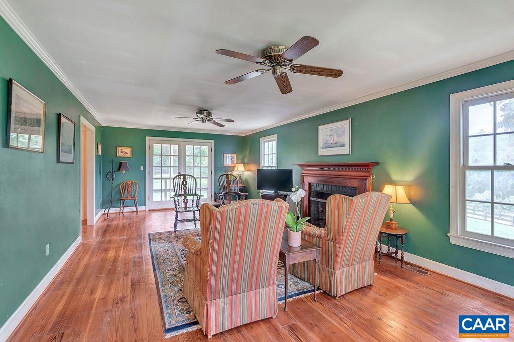 674 Gillums Ridge Road Charlottesville, VA 22903 - Photo 14 of 50 a view of a dining room with furniture window and wooden floor
