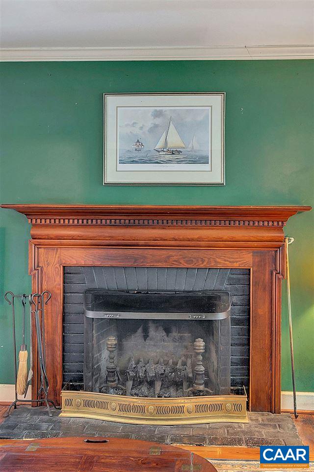 674 Gillums Ridge Road Charlottesville, VA 22903 - Photo 15 of 50 a view of a fireplace with wooden floor