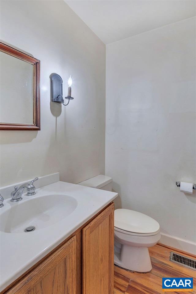 674 Gillums Ridge Road Charlottesville, VA 22903 - Photo 20 of 50 a bathroom with a sink a toilet and mirror