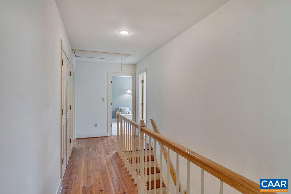 674 Gillums Ridge Road Charlottesville, VA 22903 - Photo 31 of 50 a view of a hallway with wooden floor