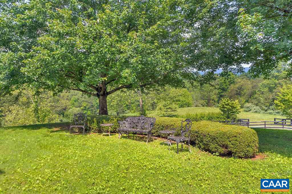 674 Gillums Ridge Road Charlottesville, VA 22903 - Photo 42 of 50 a backyard of a house with a yard and outdoor seating