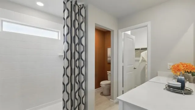 a bathroom with a sink vanity and a mirror