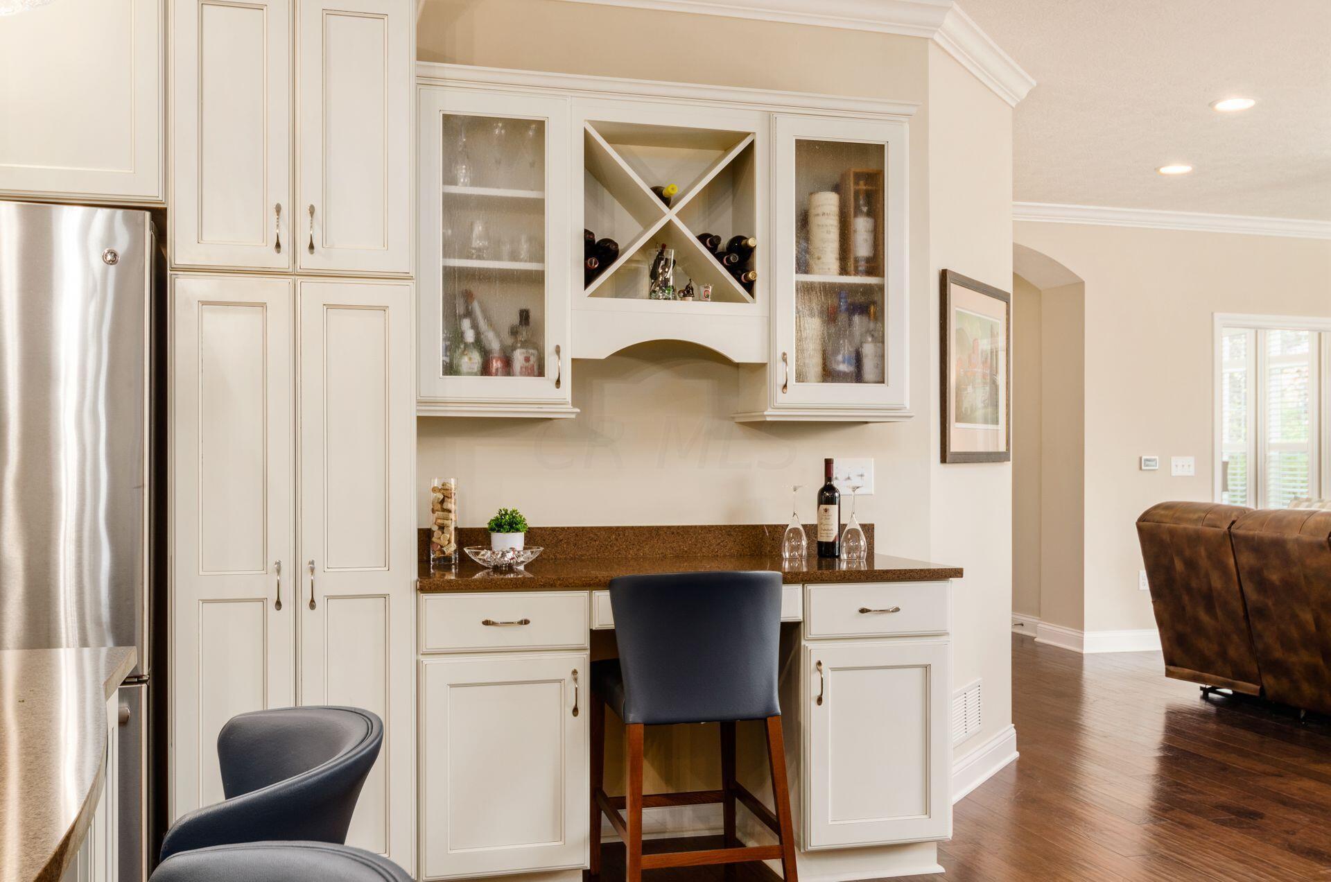 6960 Morningstar Loop Westerville, OH 43082 - Photo 16 of 47 Custom desk/bar area creates an additional workspace/entertainment area.