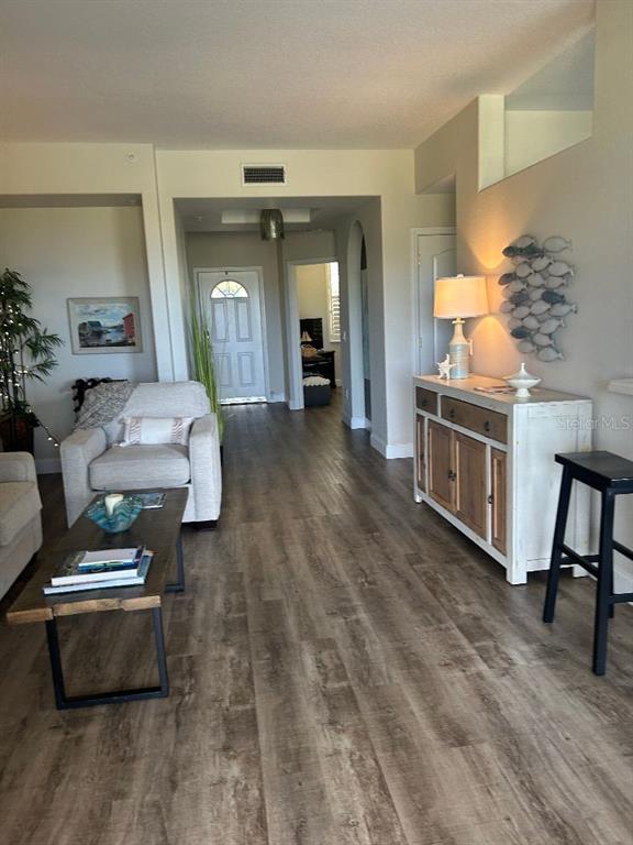 940 Cooper Street, Unit 302 Venice, FL 34285 - Photo 6 of 28 a living room with furniture and a fireplace
