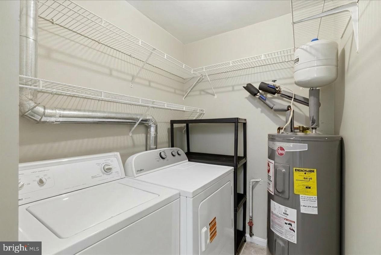 8582 Adamson Street Manassas, VA 20110 - Photo 13 of 24 a utility room with dryer and washer