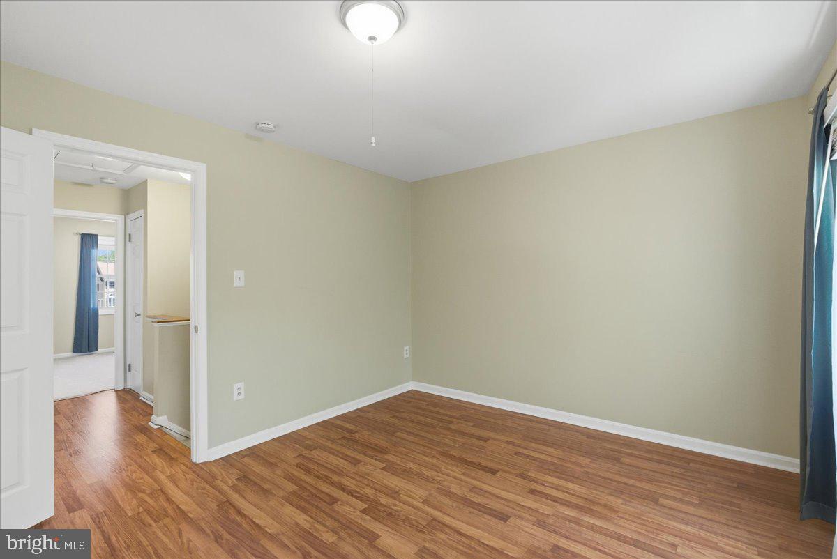 8582 Adamson Street Manassas, VA 20110 - Photo 17 of 24 a view of a room with wooden floor