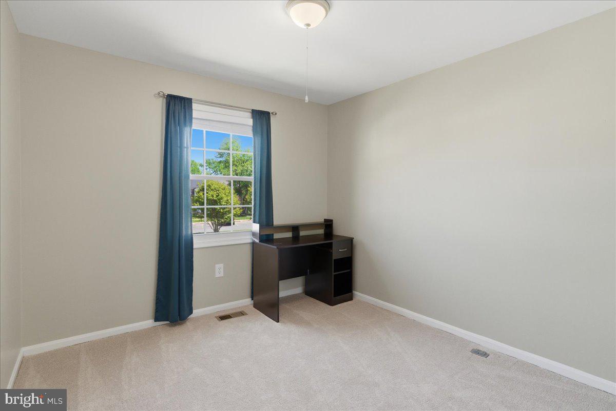 8582 Adamson Street Manassas, VA 20110 - Photo 19 of 24 a view of an empty room with a window