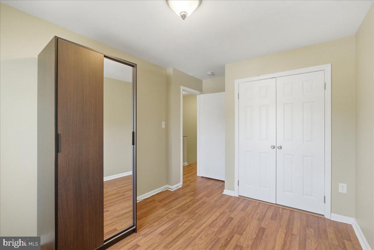8582 Adamson Street Manassas, VA 20110 - Photo 21 of 24 a view of hallway with wooden floor