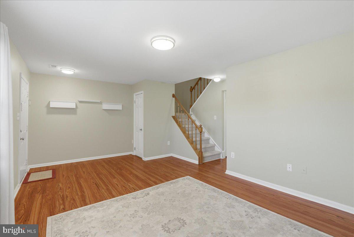 8582 Adamson Street Manassas, VA 20110 - Photo 6 of 24 a bedroom with a bed and a window