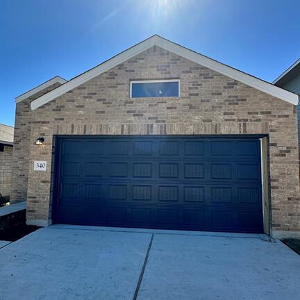 340 The Bad Way Jarrell, TX 76537 - Photo 1 of 14 Garage featuring driveway