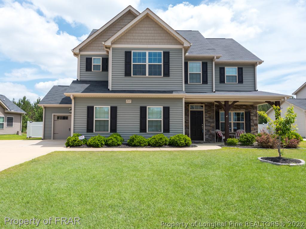 717 St Johns Loop Raeford, NC 28376 - Photo 1 of 29 front view of a house with a yard