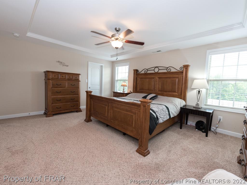 717 St Johns Loop Raeford, NC 28376 - Photo 17 of 29 a bedroom with a bed dresser and a window