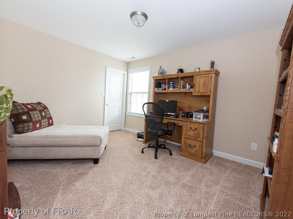 717 St Johns Loop Raeford, NC 28376 - Photo 23 of 29 a livingroom with workspace and a couch