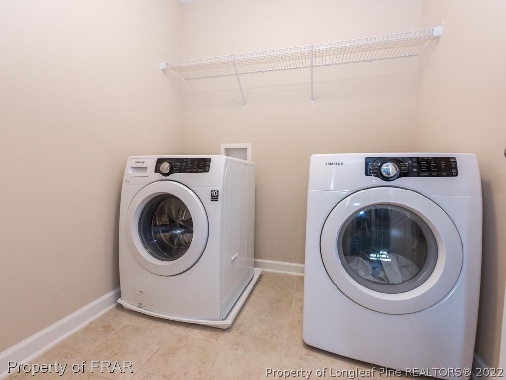717 St Johns Loop Raeford, NC 28376 - Photo 24 of 29 a utility room with dryer and washer