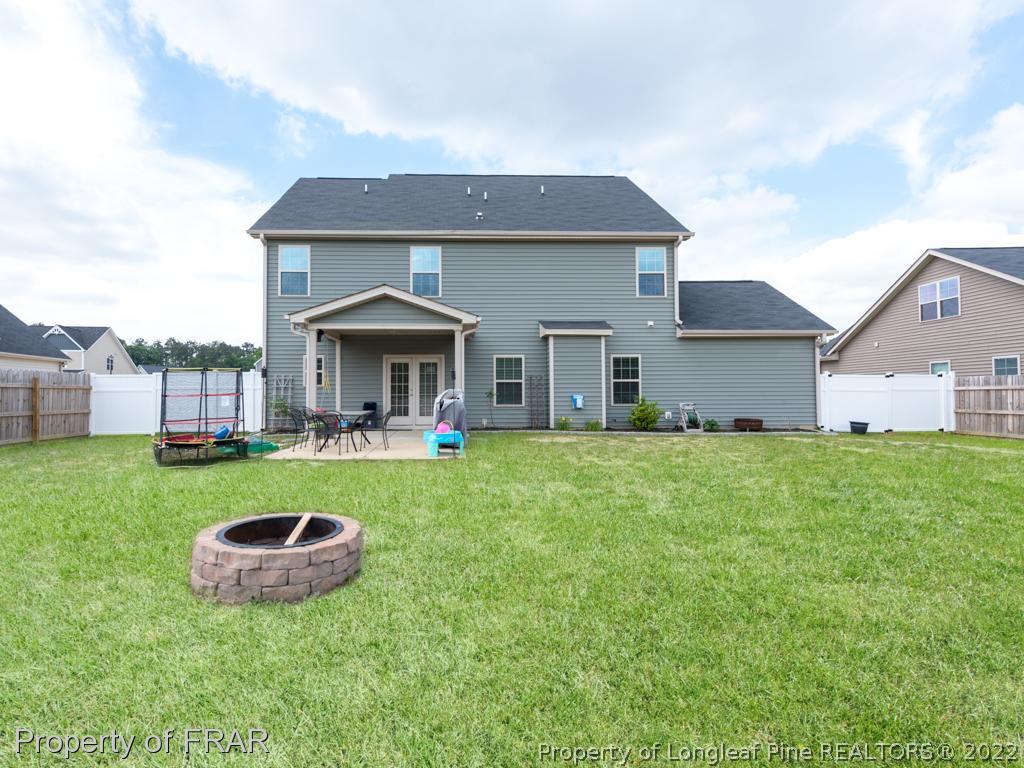 717 St Johns Loop Raeford, NC 28376 - Photo 29 of 29 a front view of house with yard and outdoor seating