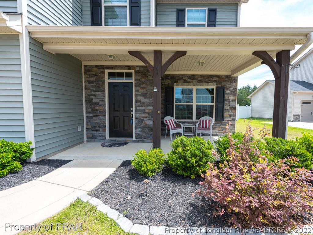 717 St Johns Loop Raeford, NC 28376 - Photo 3 of 29 a front view of a house with garden