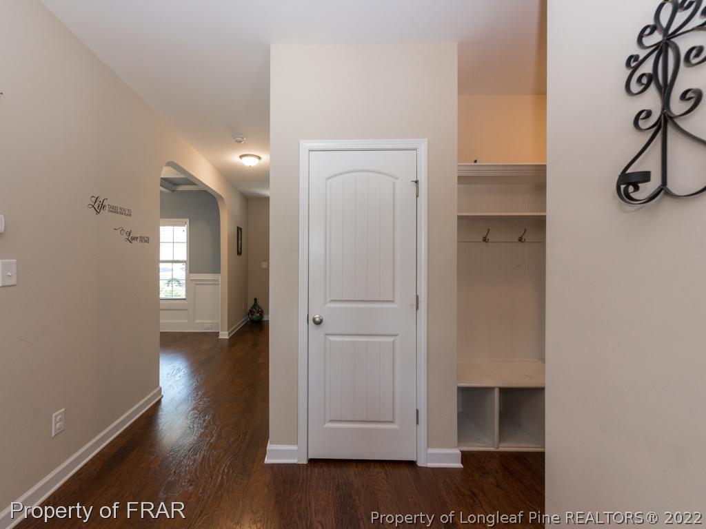 717 St Johns Loop Raeford, NC 28376 - Photo 4 of 29 a view of hallway with wooden floor